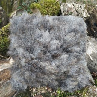 Felted fleece, sheep-friendly “sheepskin” cushion, natural shades of grey with a tiny hint of caramel – Cheviot wool -